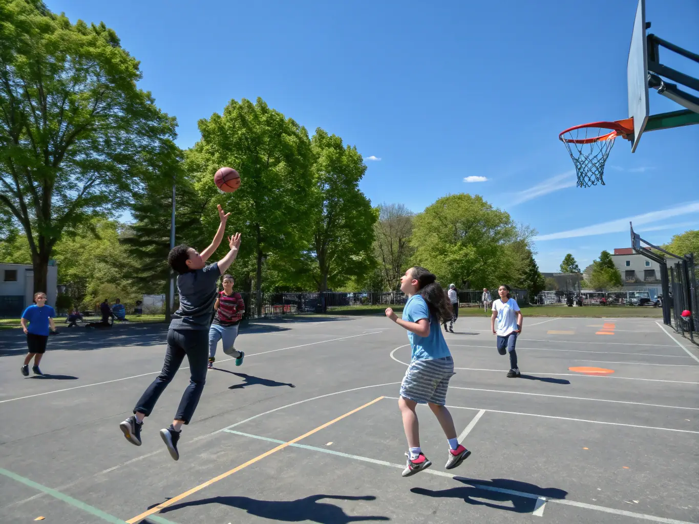 An energetic image of students playing basketball, emphasizing agility, coordination, and the competitive spirit fostered by ASSOCIATION SPORTIVE DU COLLEGE PUBLIC.