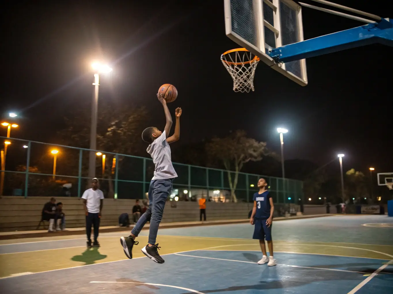 A dynamic image of students playing basketball in the school gymnasium, emphasizing agility and coordination.